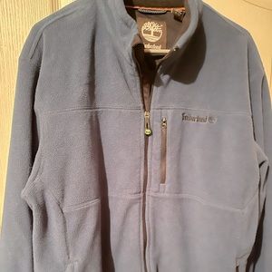 Size XL Timberland zip up. Great condition. 100% polyester.
